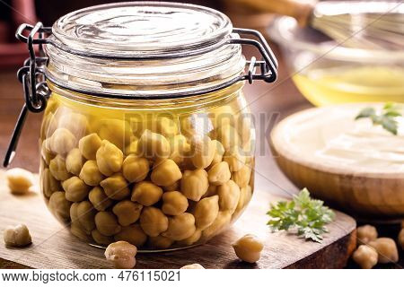 Chickpeas With Aquafaba Vegan Mayonnaise In The Background, Mayonnaise Made With Vegetables And Egg 