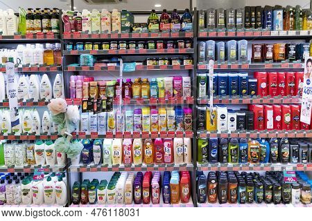 Latvia, Riga, May, 2023: Shelves With Shampoos And Conditioners With Reduced Prices On Sale In Rimi 