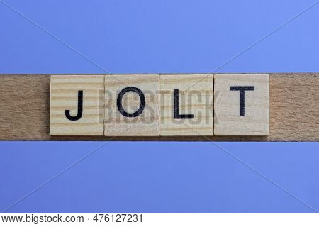 Word Jolt Made From Wooden Gray Letters Lies On A Blue Background