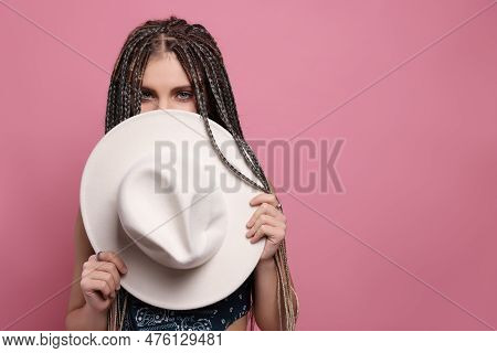 Beautiful Woman With Long African Braids And Hat On Pink Background, Space For Text