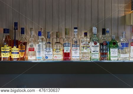 Delphi, Greece - Circa 2023: Bottles Of Alcoholic Drinks Illuminated In A Bar
