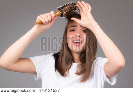 Hair Loss Woman With A Comb And Problem Hair. Hairloss And Hairs Problems. Sad Girl With Damaged Hai