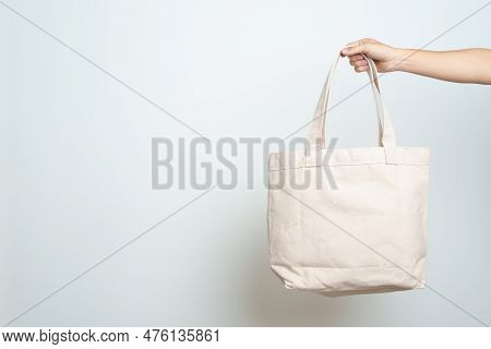 Woman Hand Holding Eco Shopping Tote Bag With Copy Space For Text. Environmental Protection, Zero Wa