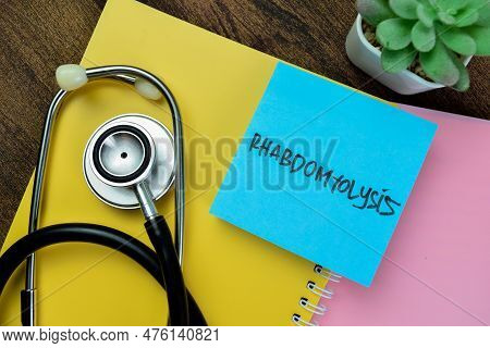 Concept Of Rhabdomyolysis Write On Sticky Notes With Stethoscope Isolated On Wooden Table.