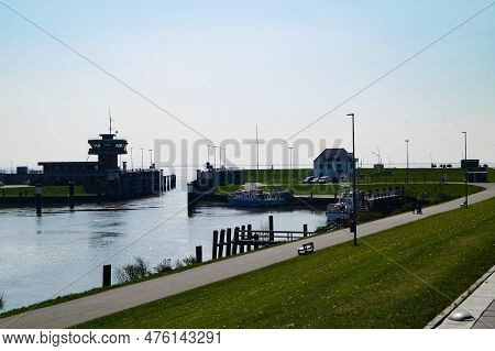 Buesum Is A Village At The German Northern Sea With Harbor And Lighthouse