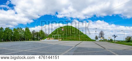 The Liberation Mound In Piekary Slaskie Against The Blue Sky With White Clouds