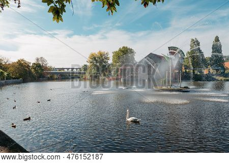 City Fountain And Pond With Swan And Ducks In Old European City Bietigheim-bissingen In Germany. The