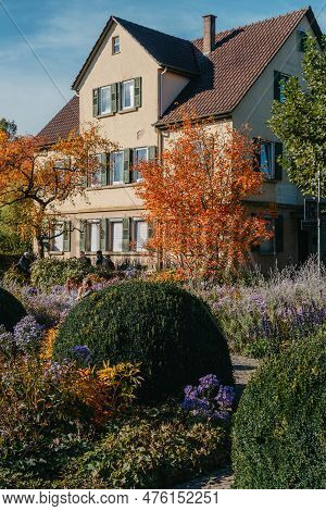 House With Nice Garden In Fall. Flowers In The City Park Of Bietigheim-bissingen, Baden-wuerttemberg