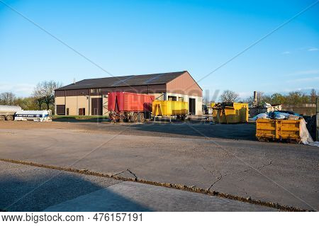 Meerhout, Antwerp Province, Belgium - April 25, 2023 - The Main Court Of A Modern Farm With Barns An