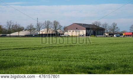 Meerhout, Antwerp Province, Belgium -  April 21, 2023 - Green Field With The Biogas Energy Plant Boo