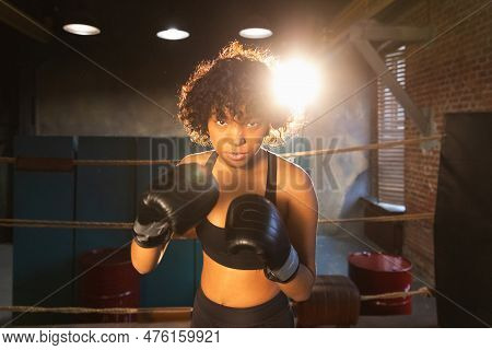 Outcry Independent Girl Power. Angry African American Woman Fighter With Boxing Gloves Looking Serio
