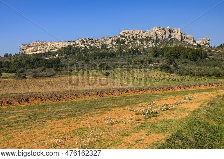 The Massive Rock Of Les Baux De Provence (france) On A Clear Sunny Day In Springtime With Blue Sky