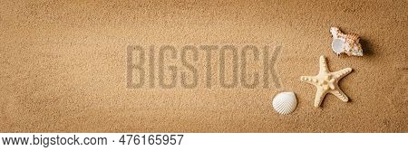 Flat Lay Composition With Beautiful Starfishes And Sea Shells On Sand Top View, Space For Text, Web 