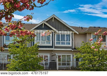 Facade Of New Residential Townhouses. Apartment Buildings In Canada. Modern Complex Of Apartment Bui