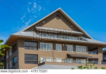 Facade Of New Residential Townhouses. Apartment Buildings In Canada. Modern Complex Of Apartment Bui