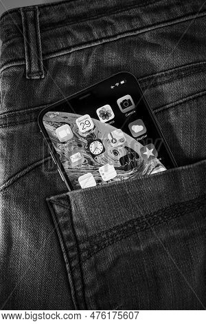 Paris, France - Sep 29, 2018: A Striking Black And White Photo Of A Denim Pocket Featuring An Apple 