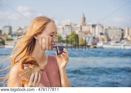 Woman In Istanbul Having Breakfast With Simit And A Glass Of Turkish Tea. Glass Of Turkish Tea And B