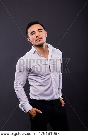Cheerful Young Guy 20s In Classic Shirt Isolated On Dark Wall Background Studio Portrait.