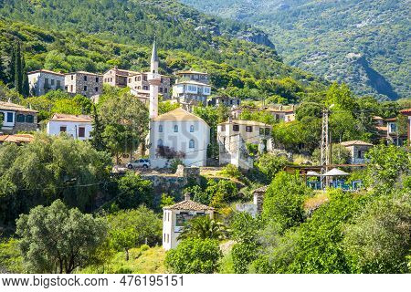 The Landscape Of Doganbay Village And Stone House On A Summer And Sunny Day.