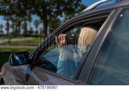 Hidden Photographing. Paparazzi Concep Photographer Uses His Professional Camera. Photographer Girl 