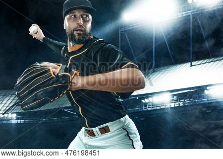 Porfessional Baseball Player With Ball On Grand Arena. Ballplayer On Stadium In Action.