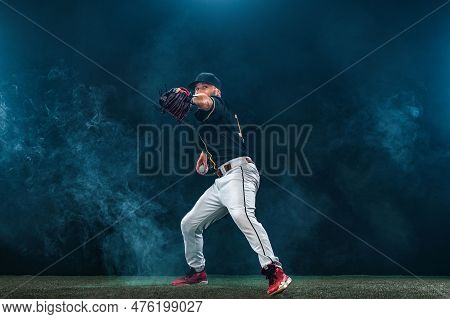 Baseball Player On Dark Background. Ballplayer Portrait.