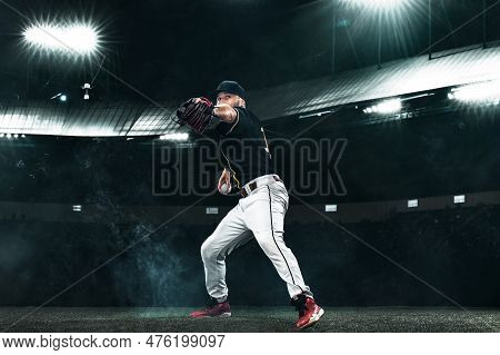 Porfessional Baseball Player With Ball On Grand Arena. Ballplayer On Stadium In Action.