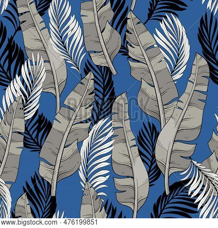 Seamless Pattern Wallpaper Of Tropical Gray Leaves Of Palm And Banana Leaves On A Blue Background