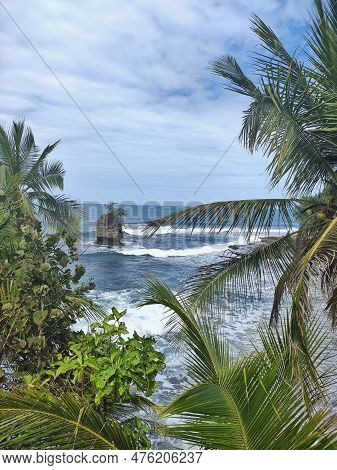 Beautiful View From Manzanillo National Park Of A Small Rock Reef In The Caribbean Sea In Costa Rica