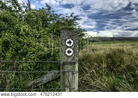 Post With Footpath Signs In The Harperrig Nature Reserve, Located In The Pentlands Nature Park, Edin
