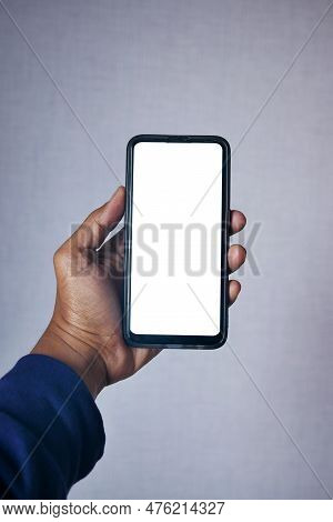 Young Man Hand Using Smart Phone With White Scren