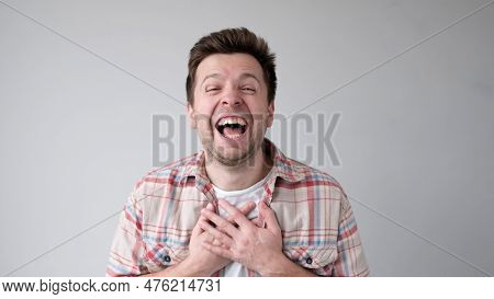 European Funny Young Man Is Laughing Loudly. Positive Emotion