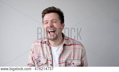 European Funny Young Man Is Laughing Loudly. Positive Emotion