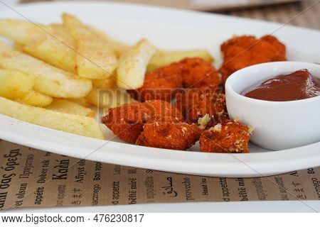 Chicken Nuggets With French Fries And Sauce