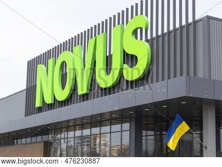 Ukrainian Supermarket Chain Novus. Green Large Signboard Of The Shopping Center Outside, On The Stre