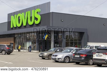 Ukrainian Supermarket Chain Novus. Green Large Signboard Of The Shopping Center Outside, On The Stre