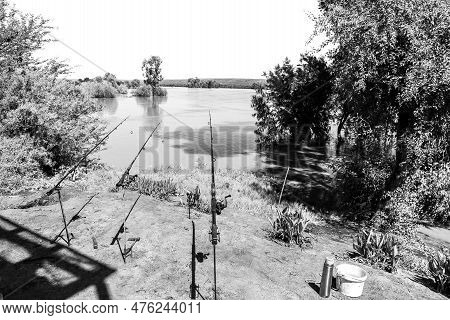 Fishing Rods At Samevloeiing Near Douglas Where The Orange And Vaal Rivers Join. Monochrome