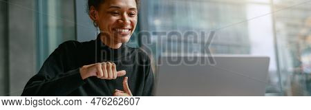 Woman Freelance Architect Talking With Client Via Video Call And Discuss Project Sitting In Cafe