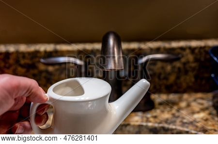 Improperly Filling A Neti Pot With Nonsterile Tap Water.
