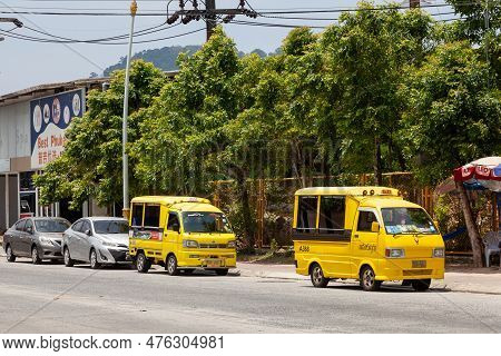 Thailand, Patong - 03.27.23: Small Japanese Trucks Converted Into Taxis For Tourists Called Tuk Tuk 