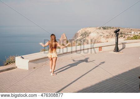 Woman Summer Dance. Silhouette Of A Happy Woman Who Dances, Spins And Raises Her Hands To The Sky. A