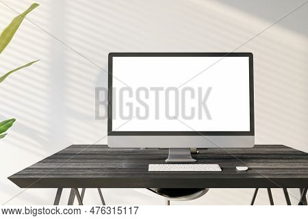 Front View Of A Home Workplace With Black Desk With Blank Screen Modern Computer On Light Wall Backg