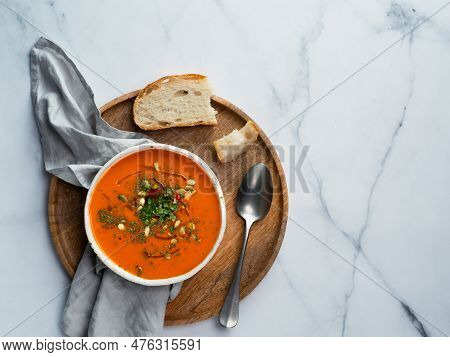 Gaspacho Soup On Round Wooden Tray Over White Marble Tabletop. Bowl Of Traditional Spanish Cold Soup