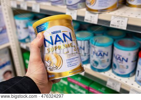 Infant Milk Powder Nan Supreme Baby Formula Produced By Nestle For Sale In A Store. Customer Choosin