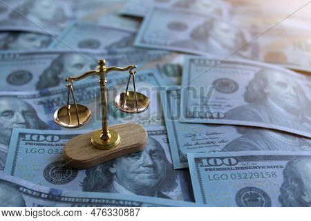 Balancing Scale On Top Of Money. Law, Bribery, Justice And Corruption Concept