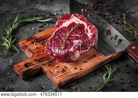 Meat Processing Plant. Carcasses Of Beef Hang On Hooks.