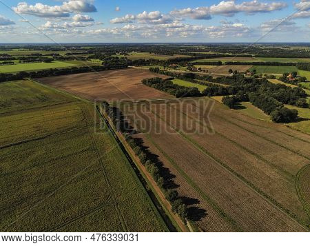 Aerial View Of A Stream Through Various Fields And Farms Somewhere In The Netherlands