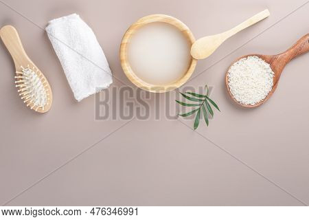 Homemade Cosmetic Rice Water With Ingredients On Beige Background, Healthy Beauty Hair Treatment Ing