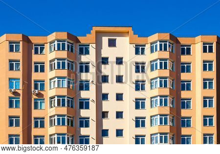 New Multi-storey, Apartment Building, Against A Blue Sky, Bottom View.