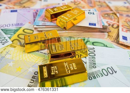 Euro Banknotes And Gold Bars. Gold Bars On Money